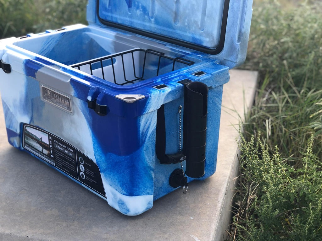 Blue Iceland Cooler with open lid, interior basket, and mounted black fishing rod holder for hands-free use during outdoor fishing trips.