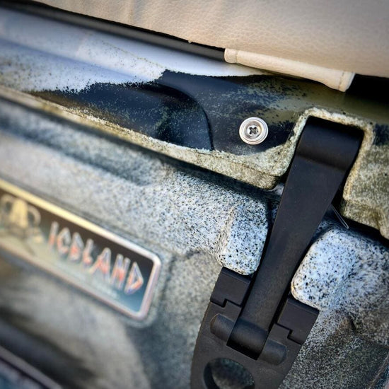 Close-up of Iceland Coolers ice chest with UV-reflective seat cushion and secure rubber latching system.