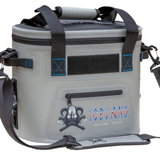 Gray Iceland Coolers Saga Series 12-can soft cooler with padded strap, blue trim, front pocket, and Viking logo branding.