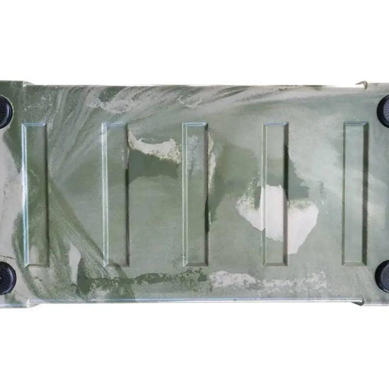 Bottom view of Iceland Coolers Viking Series 75QT in camo green, showing non-slip feet and molded ridges for stability.